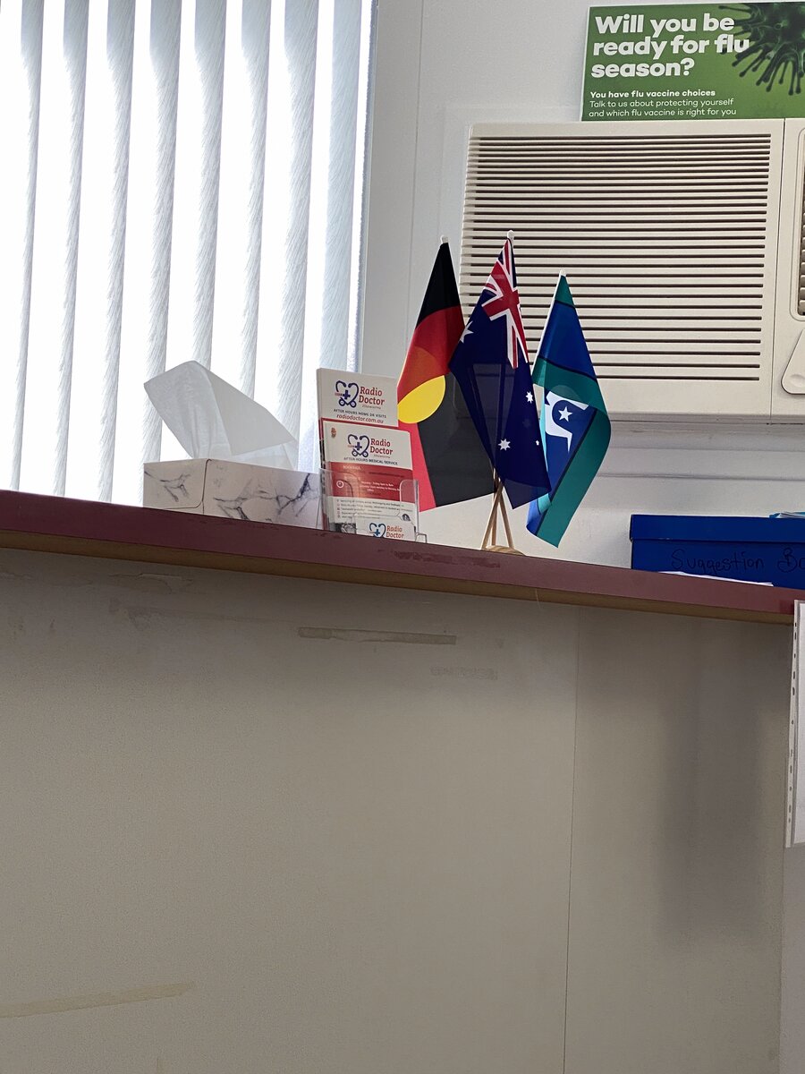 Reception desk with Australian and Aboriginal flags
