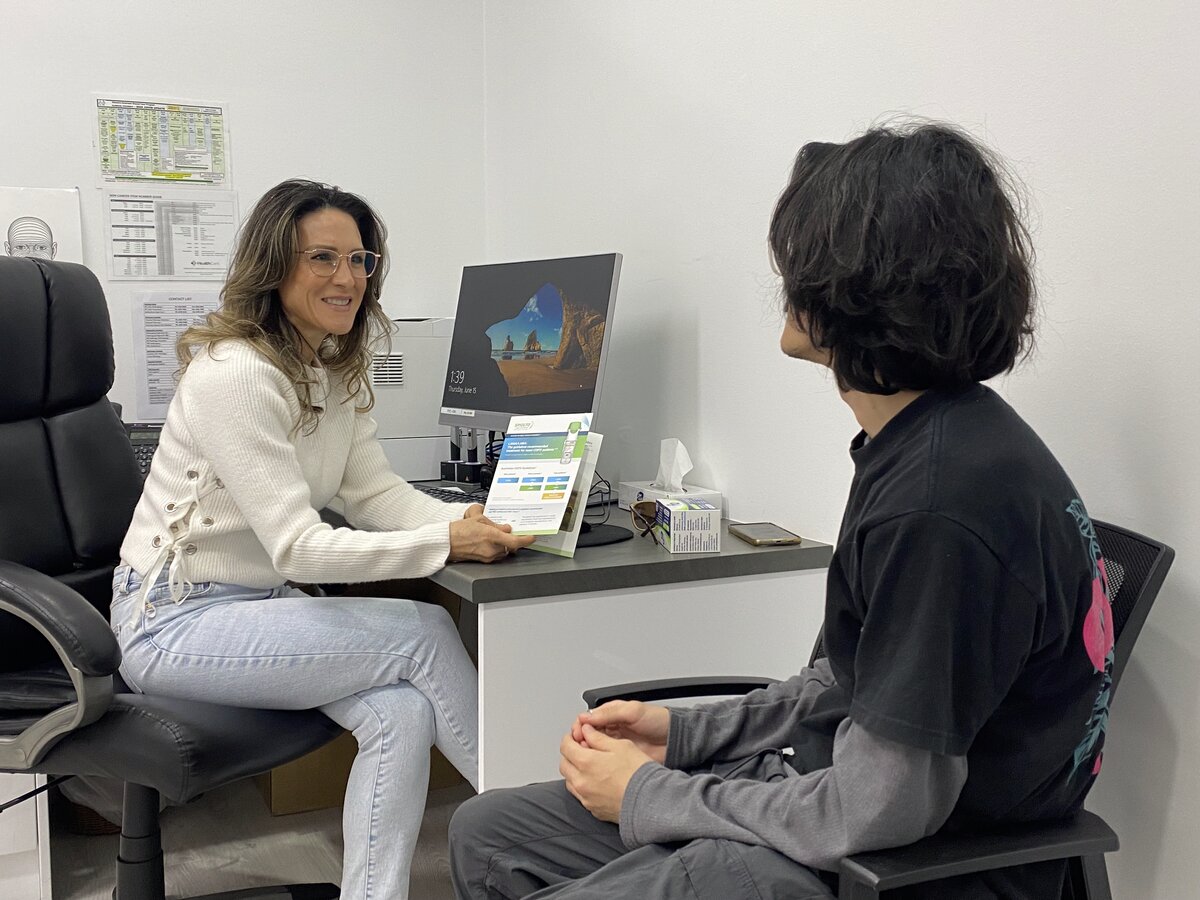 Health professional consulting with patient