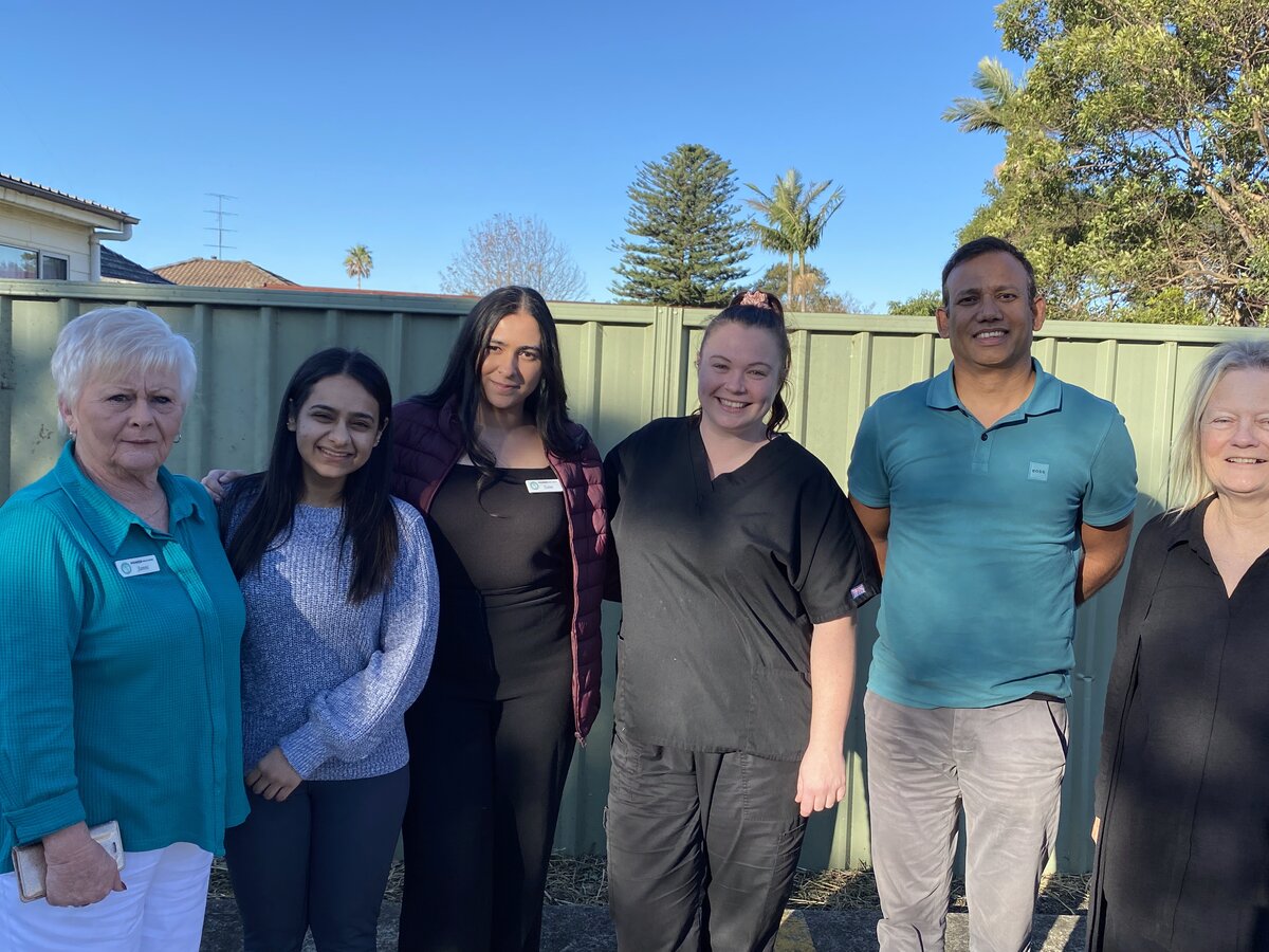 Team members standing together outside