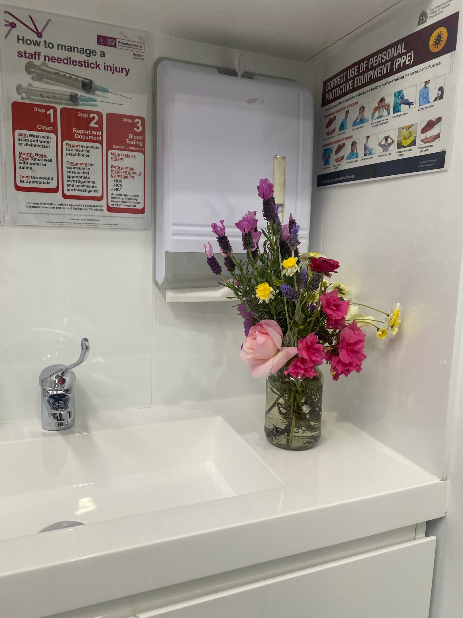 Fresh flower bouquet beside the clinical sink area